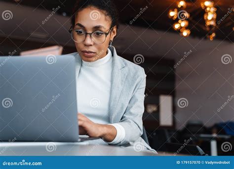 Image Of African American Businesswoman Working On Laptop In Office