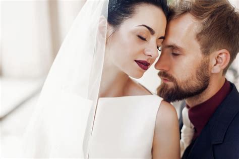 Premium Photo Elegant Stylish Groom Gently Embracing Gorgeous Bride