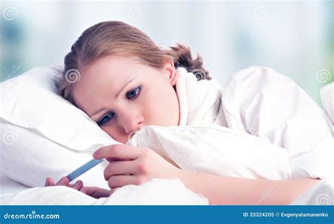 Woman With Thermometer Sick Colds Flu Fever In Bed Stock Image