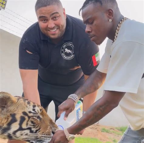 Dababy Spends Time Feeding Lions And Tigers In Dubai Blacgoss