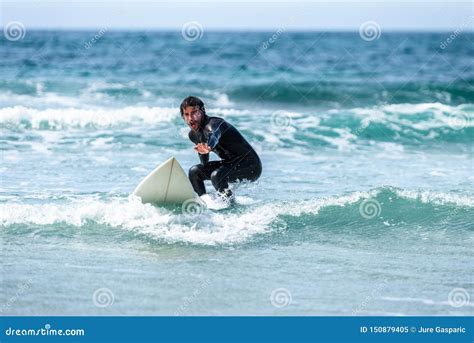 Surfer Guy Surfing With Surfboard On Waves In Atlantic Ocean Stock Image Image Of Sporty