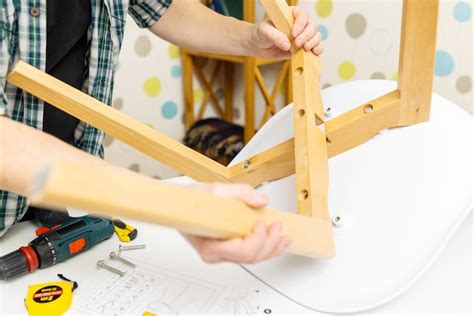 Premium Photo Assembling Wooden Furniture At Home