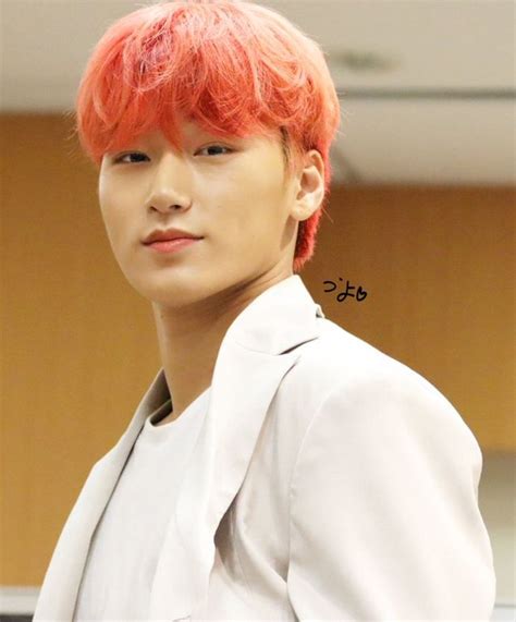 A Man With Red Hair Wearing A White Jacket