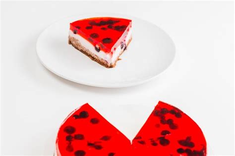 Free Photo | Slice of red jelly cake on white plate