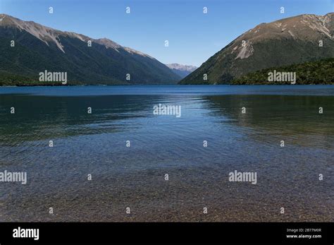 The Clear Waters Of Lake Rotoiti Move From The Shallows Out To The Deep