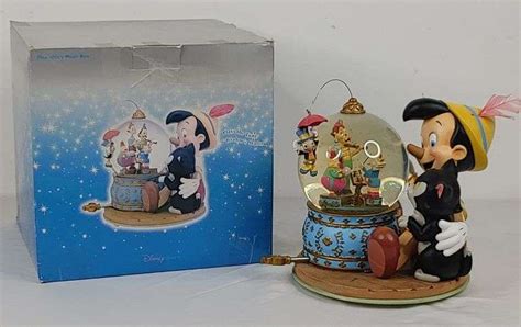 Disney, Pinocchio Musical Snow Globe - Colorado Premier Realty & Auction Services