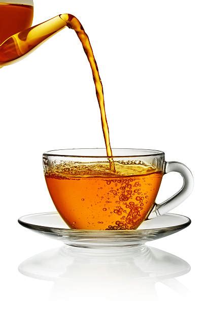 Best Teapot Pouring Tea Stock Photos Pictures And Royalty Free Images