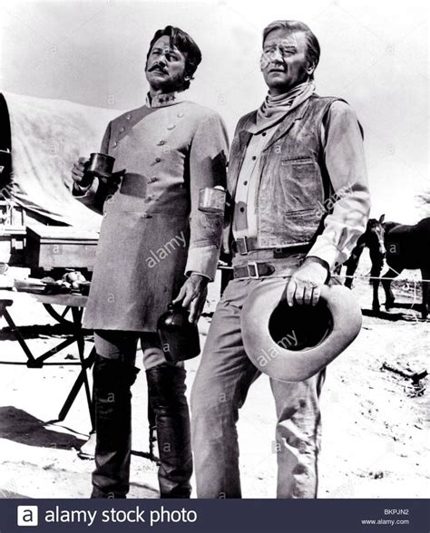 The Undefeated 1969 Rock Hudson John Wayne Und 003 P Stock Photo