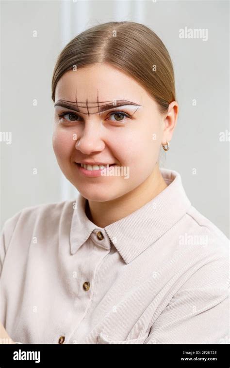 Makeup Artist Applies Eyebrow Tint For The Permanent Makeup Of A Young