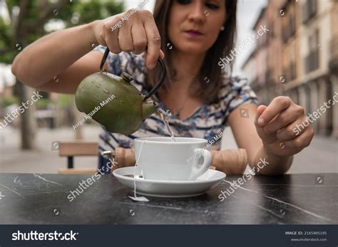 Serious Brunette Woman Pouring Tea Into Stock Photo Shutterstock