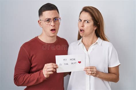 Mother And Son Holding My Mom Is The Best Card In Shock Face Looking Skeptical And Sarcastic