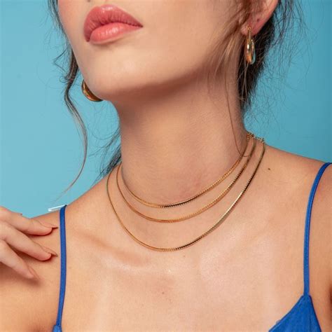 VANITÉ BOUTIQUE CHOKER LAMINADA FITA DOURADO FOLHEADO