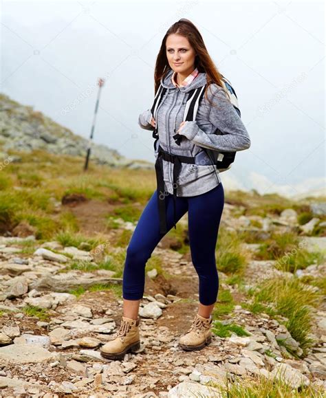 Woman hiker on a mountain trail — Stock Photo © Xalanx #32086671