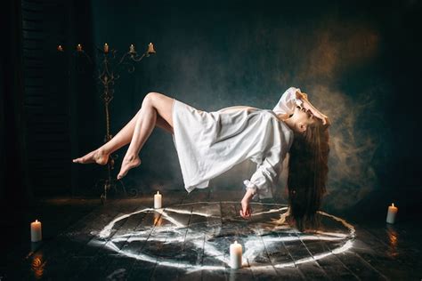 Premium Photo Young Woman In White Shirt Flying Over Pentagram Circle