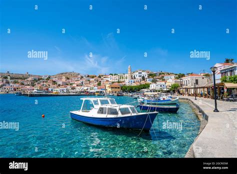 Fishing Boats In The Harbour Of Halki With Turquoise Water Waterfront