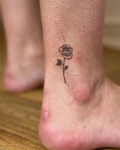 Fine Line Rose Tattoo Located On The Ankle