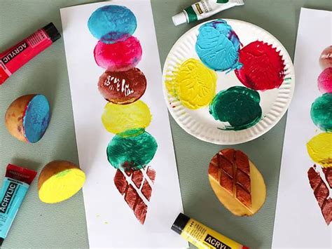 Three Paper Plates With Different Colored Cookies And Crayons Next To