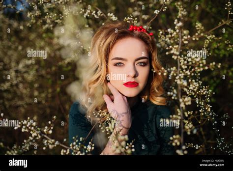 Close Up Portrait Of Yong Elegance Blonde Girl At Green Dress On The