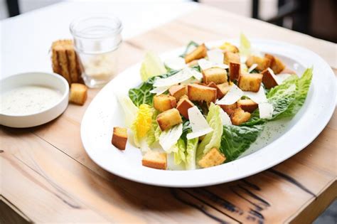 Premium Photo Whole Romaine Leaves With Caesar Dressing And Croutons
