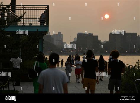 Photo By Ndz Star Max Ipx 2023 6 29 23 People Walk In Domino Park As The Air Quality Reaches