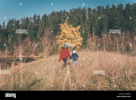 Mother And Son Walking In Nature Stock Photo Alamy