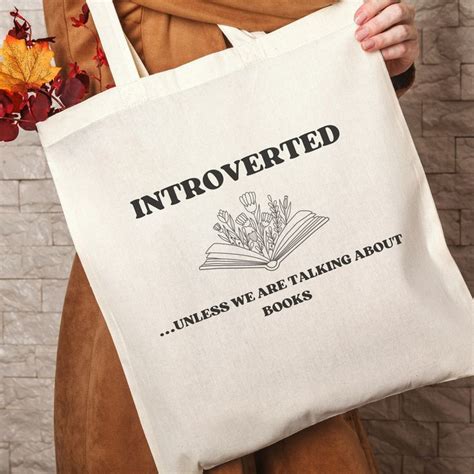 A Person Holding A Book Bag With The Words Uncovered Unless We Are