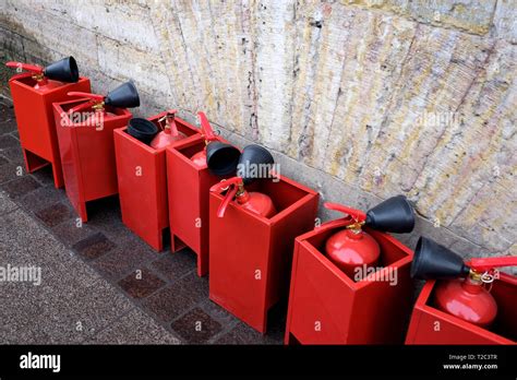 Several Red Tanks Of Fire Extinguisher Standing Outdoor Emergency