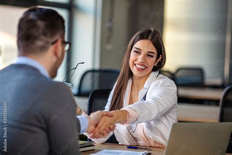 Doctor Greeting A Patient Happy Female Brunette Doctor At Medical