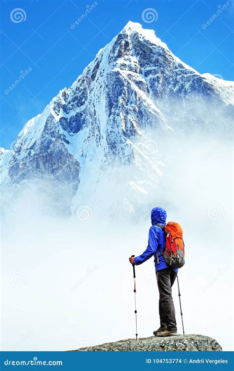 Hiker With Backpacks Reaches The Summit Of Mountain Peak Success