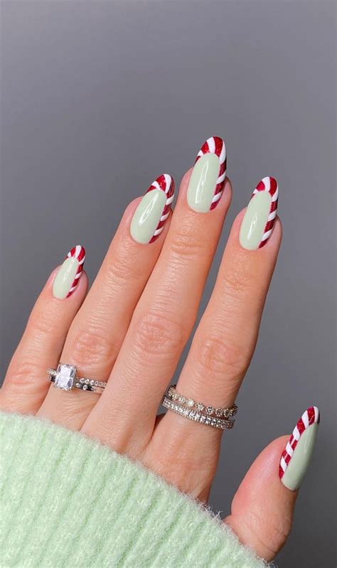 40 Festive Christmas And Holiday Nails 2021 Candy Cane Tip Nails