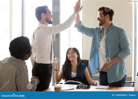 Excited Motivated Male Team People Give High Five At Meeting Stock