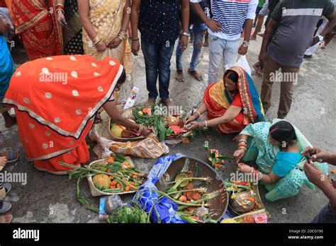 Hindu Devotees Worship The Sun God On The Banks Of The Ganges River