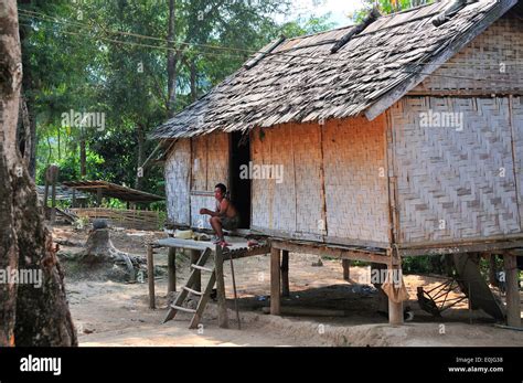 Traditional Hmong Village House On Stilts On The Banks Of The Mekong