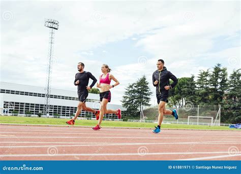 Group of Young People Running on the Track Field Stock Image - Image of ...