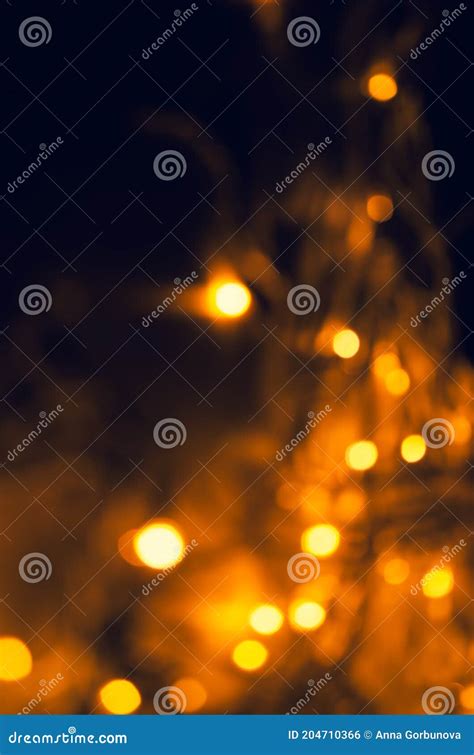 Abstract Pattern Of Golden Bokeh Lights On A Dark Background Stock