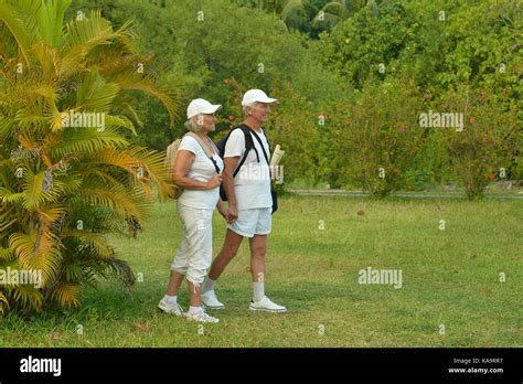 Senior Couple With Backpacks Stock Photo Alamy