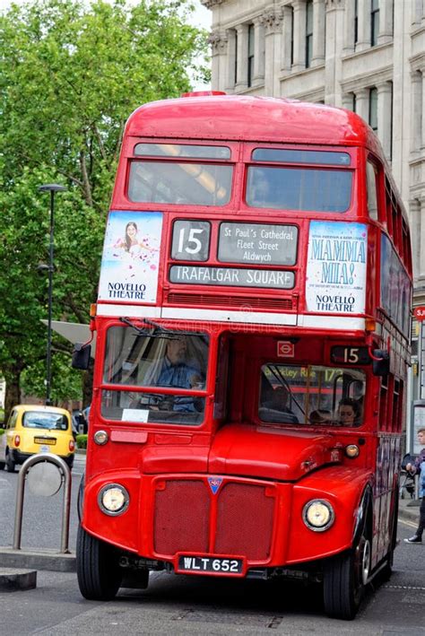Red Routemaster Double Decker Bus Left And A Sightseeing Bus Right In