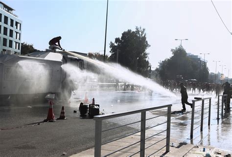 Greek firefighters clash with police at climate ministry | The Independent
