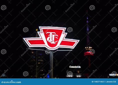 Ttc Logo On Entrance Of Subway Station In Downtown With Cn Tower In