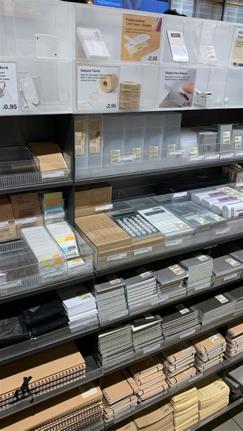 Shelves In A Store Filled With Different Types Of Papers And Folders On