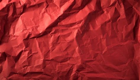 Premium Photo | Texture of crumpled red paper