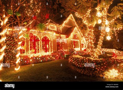 House In California With Christmas Decorations At Night Stock Photo