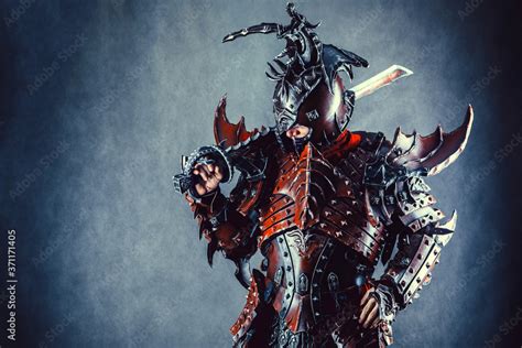 powerful knight   armor   sword dark background stock