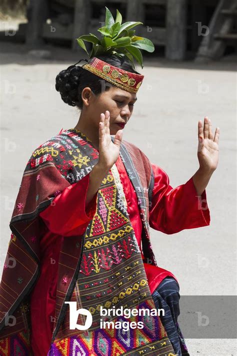 Toba Batak Woman Performing A Traditional Batak Dance At Huta Bolon