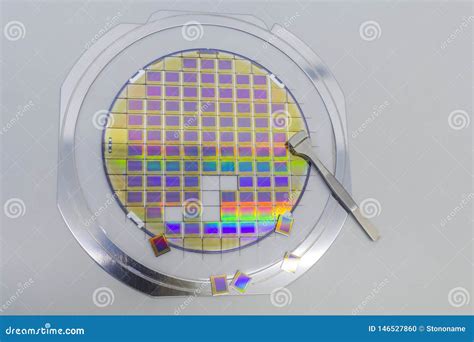 Silicon Wafer With Microchips Fixed In A Holder With A Steel Frame On