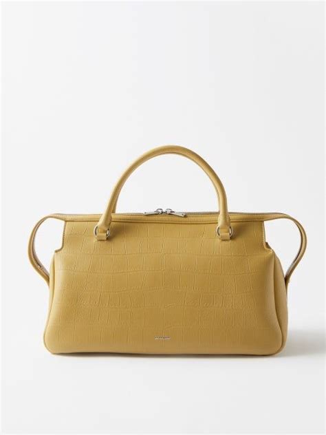 A New Style For Resort 2023 Jil Sander S Yellow Bag Is Crafted From