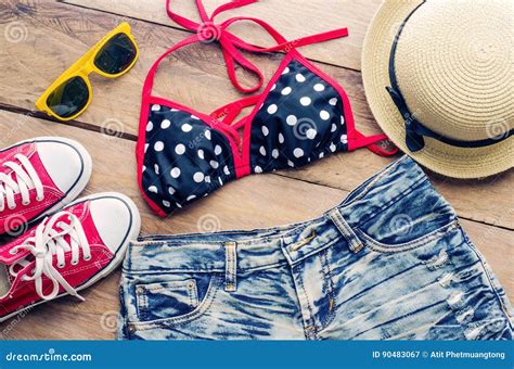 Beauty Colorful Bikini And Accessories On Wooden Floor Stock Image