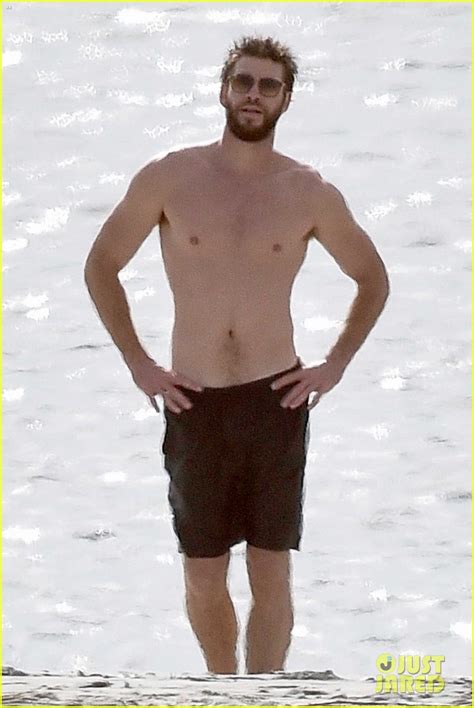 Liam Hemsworth Goes Shirtless On The Beach Where He Met Miley Cyrus