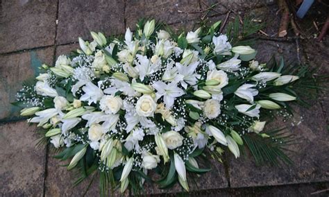 White Rose And Lily Casket Spray Casket Sprays Funeral Flowers