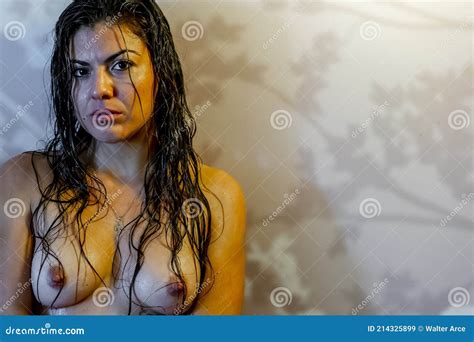 Gorgeous Hispanic Model Poses Nude In A Home Environment Stock Image